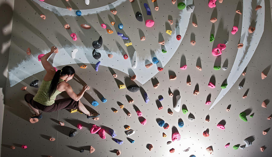 Climber Bouldering At Indoor Climbing Wall In London Photograph by ...