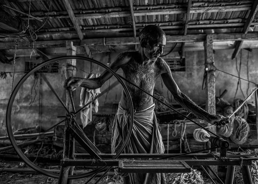 Black And White Photograph - Coconut Carpet Makers #2 by Marco Tagliarino