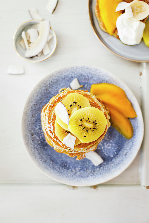 Coconut Pancakes With Kiwi And Mango #2 Photograph by Annalena Bokmeier