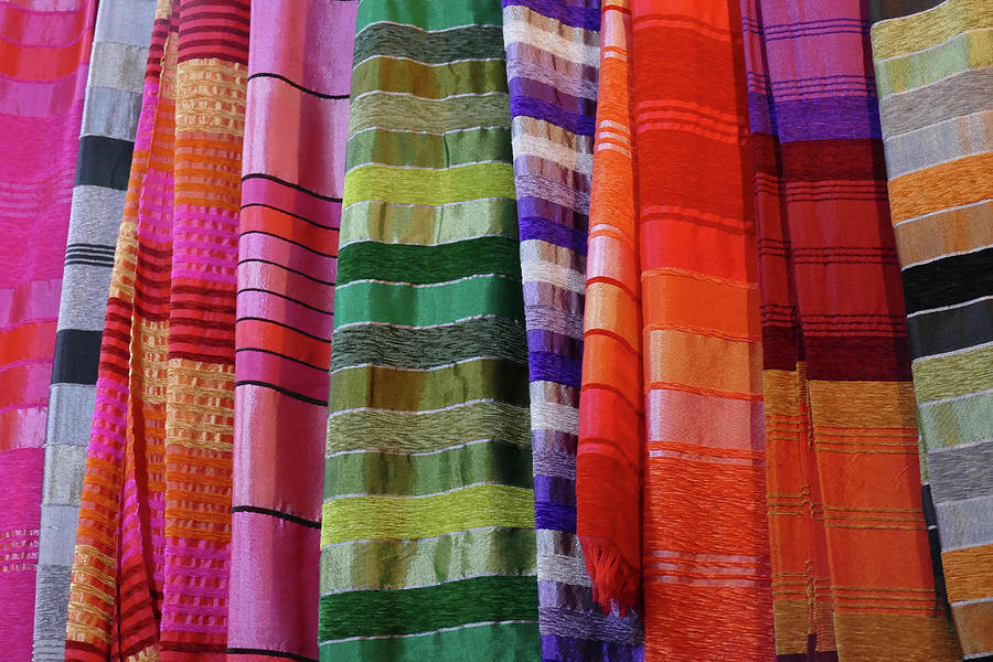Colorful fabrics in the medina market  #2 Photograph by Steve Estvanik