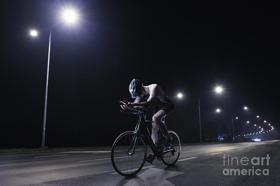 Cyclist Riding At Night In The City #2 Photograph by Stanislaw Pytel