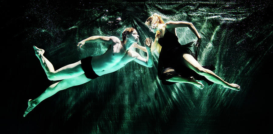 2 Dancers Meeting Under Water Photograph by Henrik Sorensen