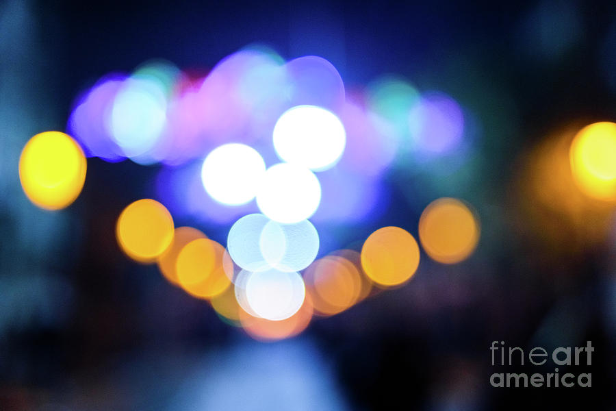 Defocused urban night background with colorful circles. #2 Photograph by Joaquin Corbalan