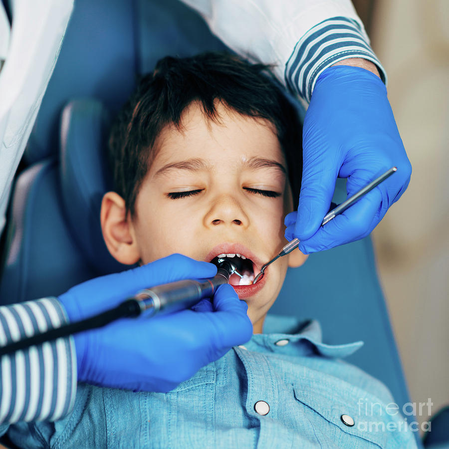 Dentist Drilling Young Boy's Tooth Photograph By Microgen Images ...