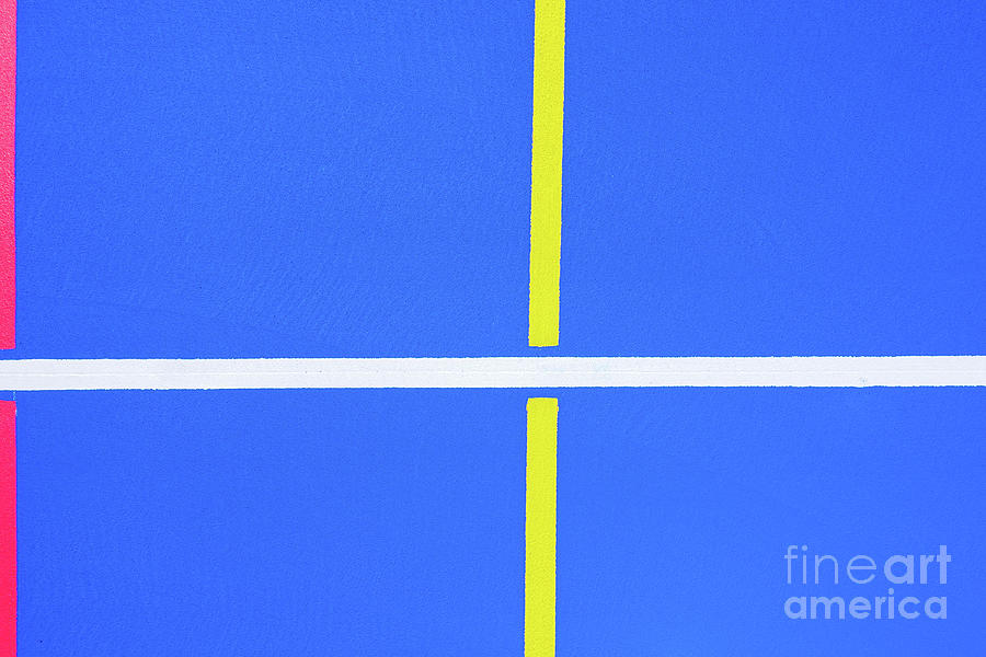 Design of a sports field, with blue background and red and yellow white lines creating strange straight lines and curves, to use with copy space. #2 Photograph by Joaquin Corbalan