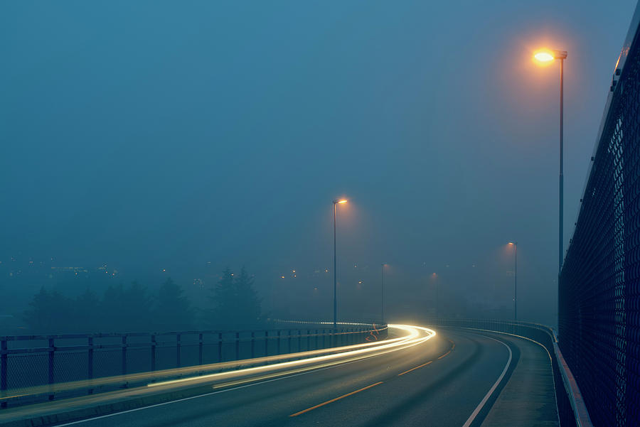 Diminishing Perspective Of Light Trails On Misty Road Illuminated By ...