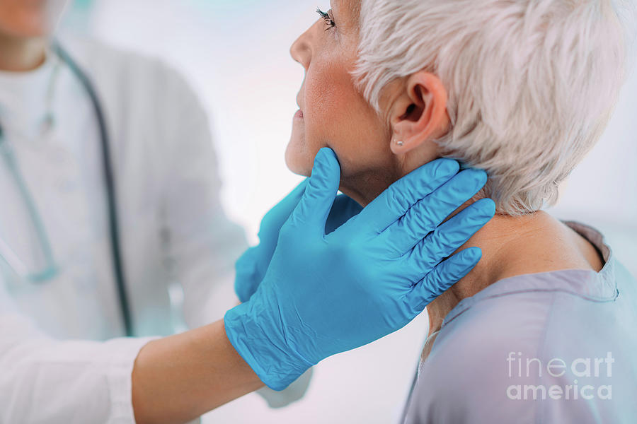 Doctor Examining A Senior Womans Neck #2 Photograph by Microgen Images/science Photo Library