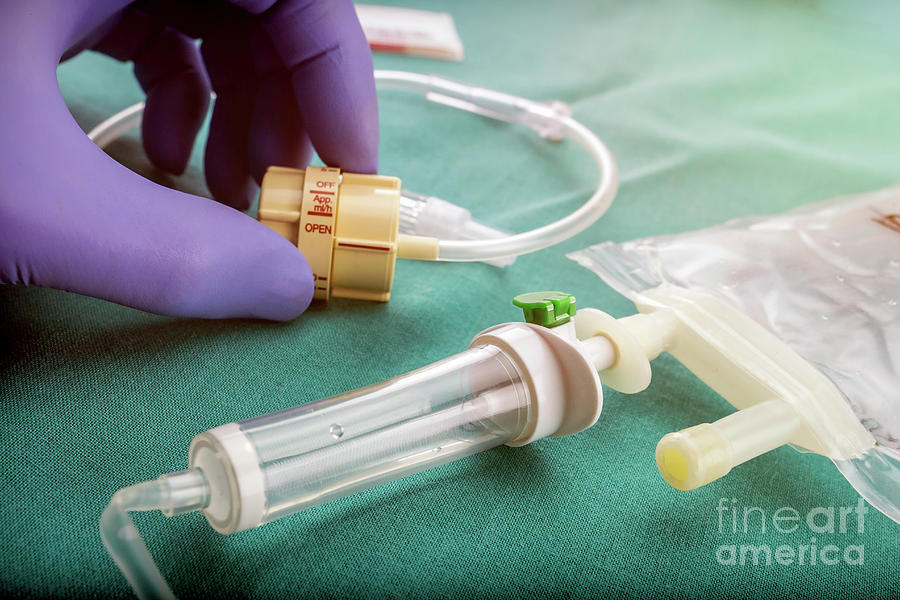 Doctor Holding Flow Dial For Iv Drip Photograph by Digicomphoto/science ...