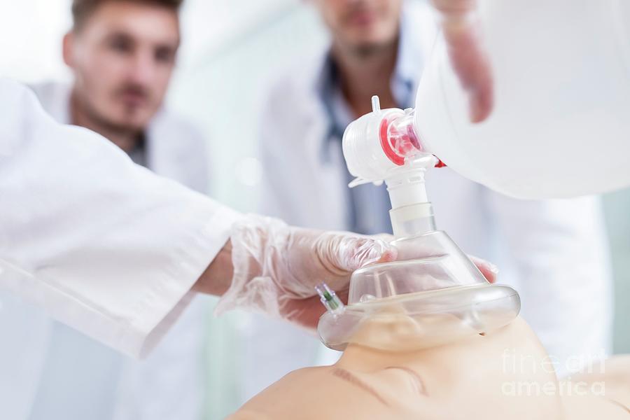 Doctor Practising Bagvalvemask Ventilation On Dummy Photograph by