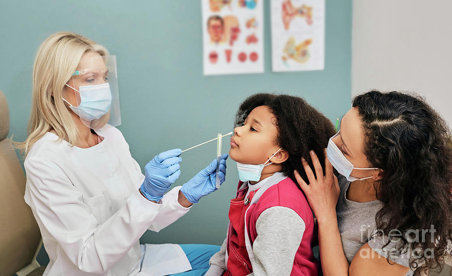 Doctor Taking Nasal Swab #2 by Peakstock / Science Photo Library