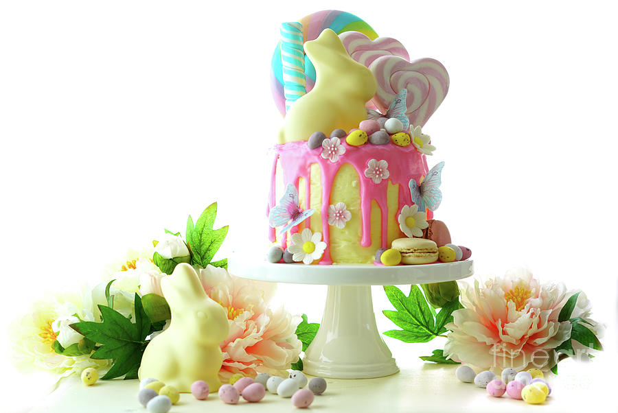Easter candy land drip cake decorated with lollipops and white bunny. #2 Photograph by Milleflore Images