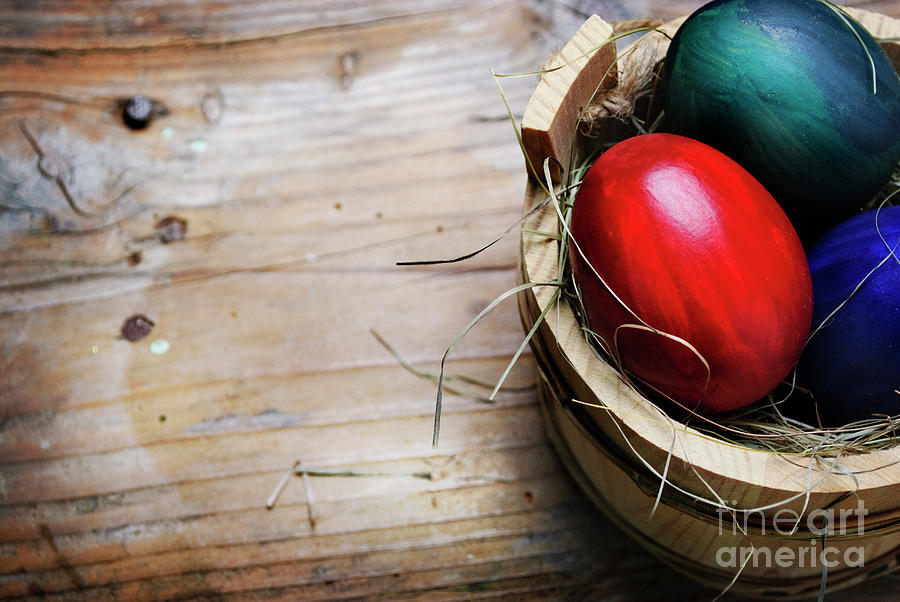 Easter Egg in Wooden Basket Photograph by Jelena Jovanovic