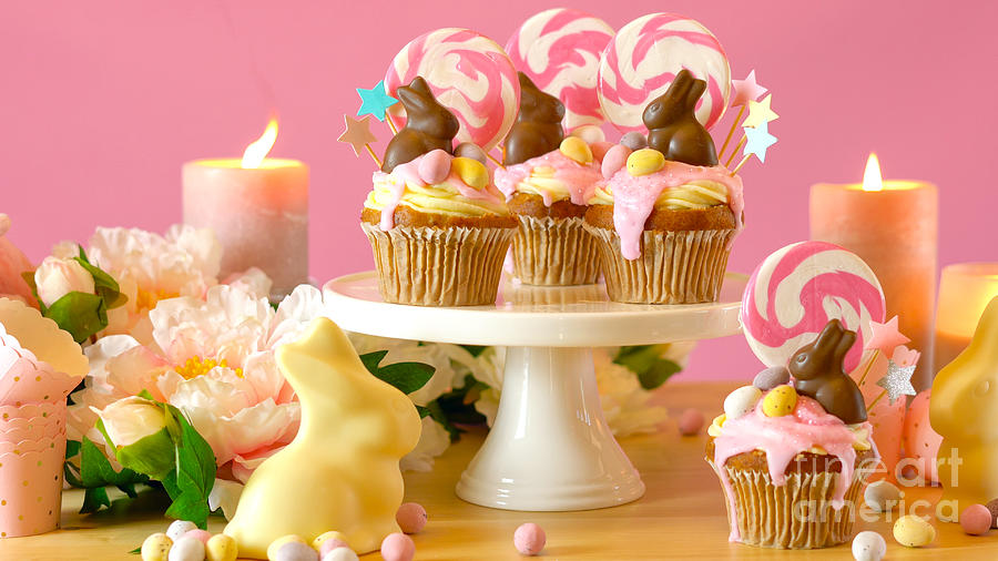 Easter theme candy land drip cupcakes in party table setting. #2 Photograph by Milleflore Images