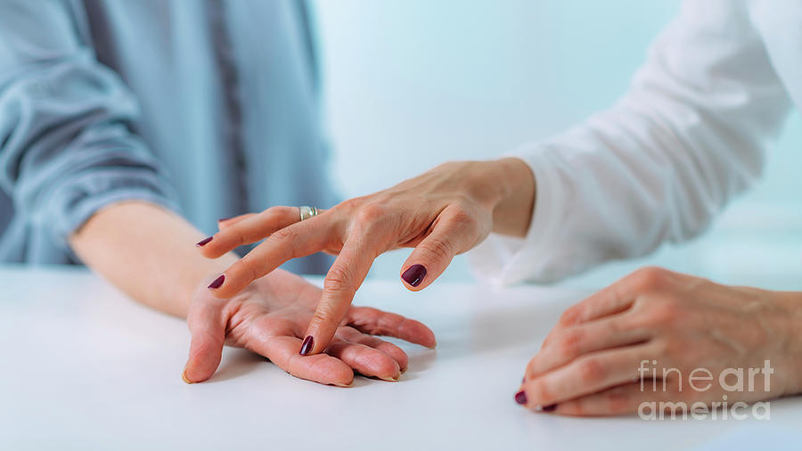 Examining The Hand Of A Patient With Carpal Tunnel Syndrome #2 Photograph by Microgen Images/science Photo Library