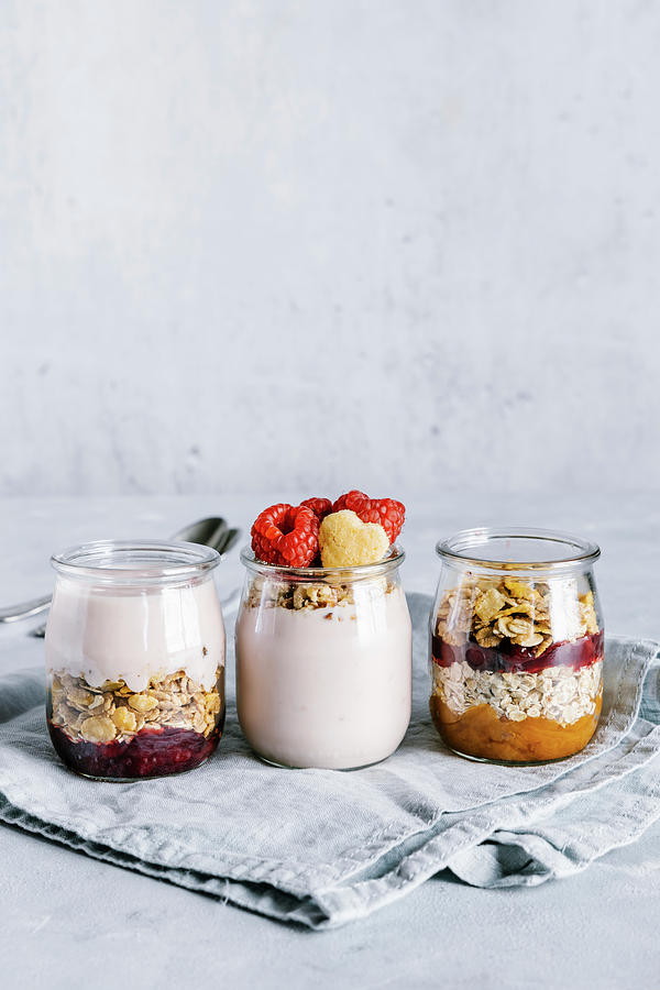 Healthy Raspberry Parfaits With Yogurt In Glass Jars #2 Photograph by Alla Machutt