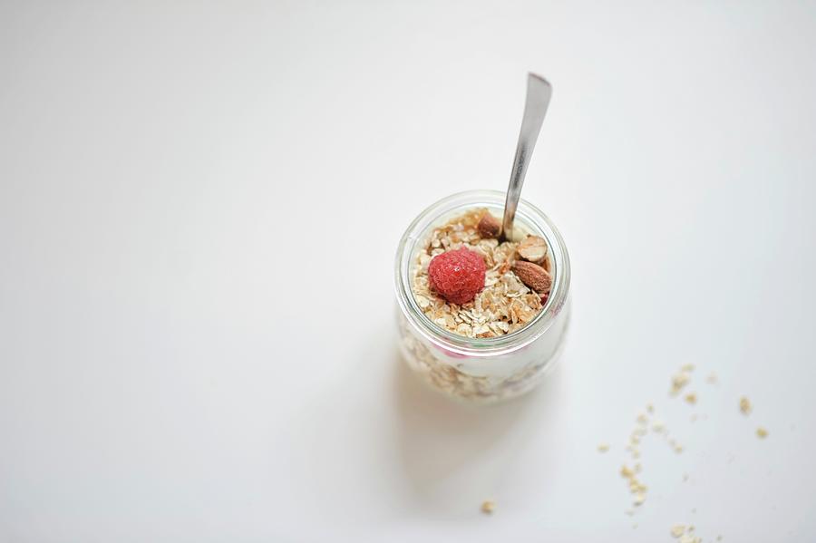 Honey And Almond Muesli With Raspberries In A Glass #2 Photograph by Alexandra Feitsch