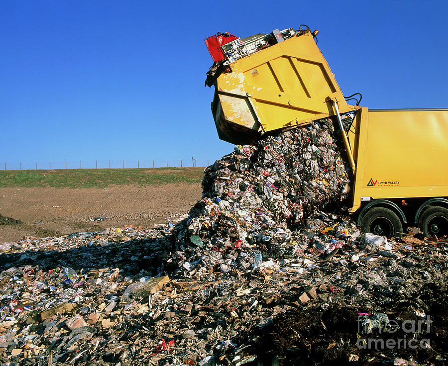 Landfill Site With Waste Truck Dumping Refuse Photograph by Simon ...