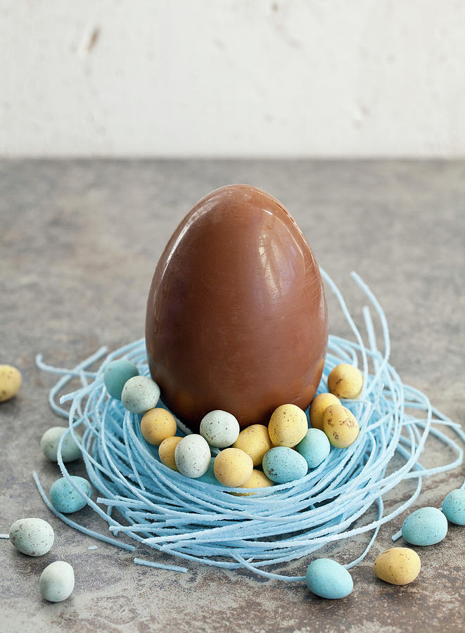Large Chocolate Easter Egg, Sitting In A Blueberry Candy Nest, Filled With Mini Chocolate Eggs #2 Photograph by Ryla Campbell