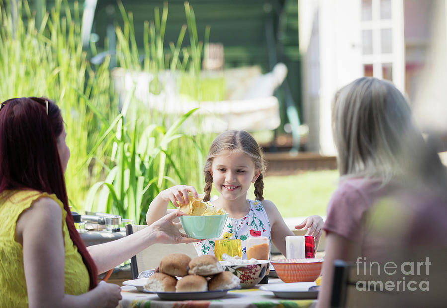 Lesbian Couple And Daughter Enjoying Lunch Photograph By Caia Image