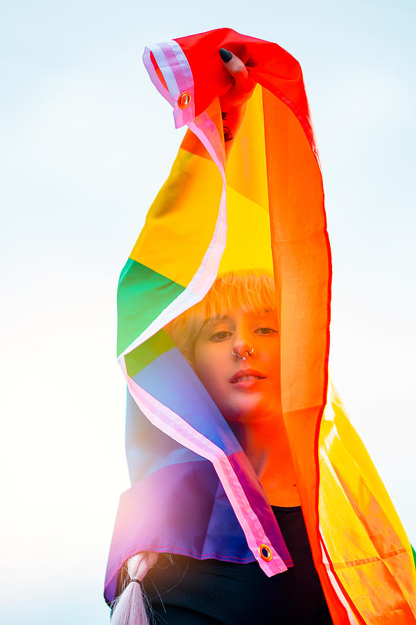 Flag Photograph - Lesbian Woman With The Flag Of Pride In Sportswear At Gay Parade #2 by Cavan Images