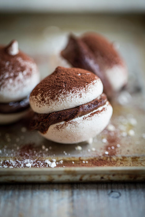 Macaroons With Chocolate Cream And Cocoa Powder #2 Photograph by Eising Studio