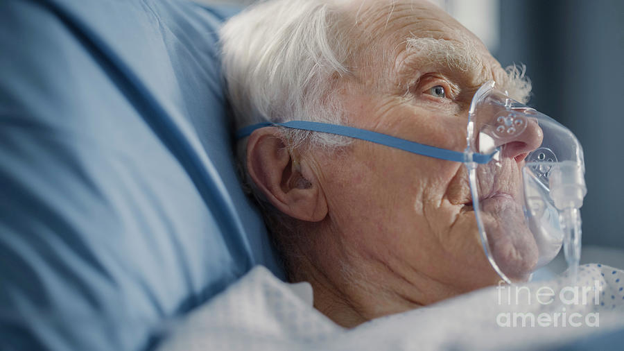 Man Wearing Oxygen Mask In Hospital Bed Photograph by Gorodenkoff ...