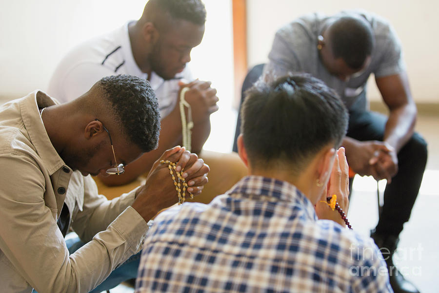 Men Praying With Rosaries In Prayer Group Photograph by Caia Image