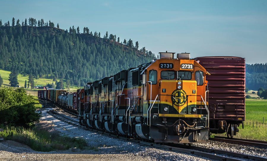 Montana landscapes with heavy train engine locomotive passing #2 Photograph by Alex Grichenko