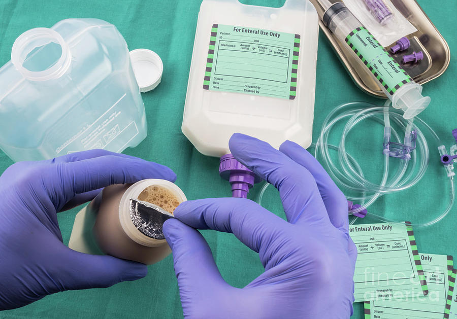 Nurse Opening Bottle Of Enteral Nutrition Photograph by Digicomphoto ...