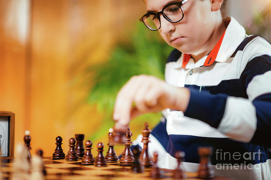 Schoolboy Playing Chess Photograph by Microgen Images/science Photo Library