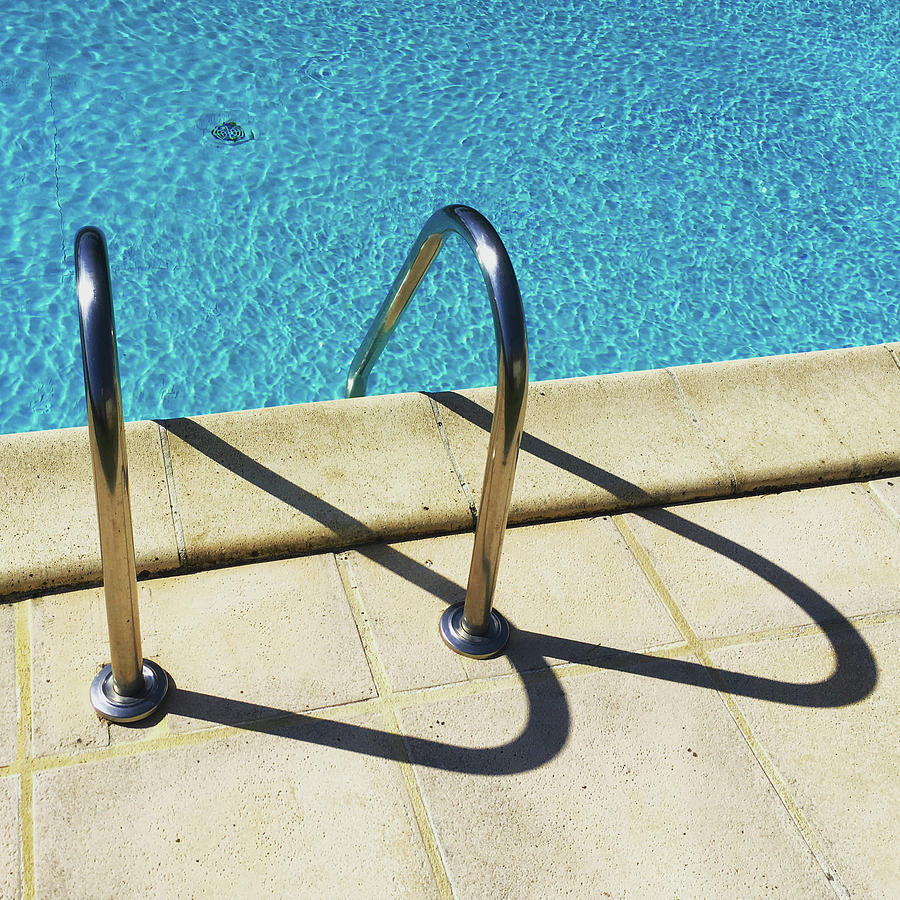 Semi-abstract swimming pool ladder shadows. #2 Photograph by Seeables Visual Arts