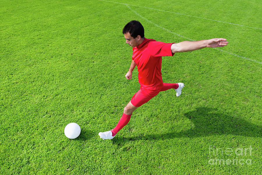 Soccer Player Kicking Ball #2 Photograph by Microgen Images/science Photo Library