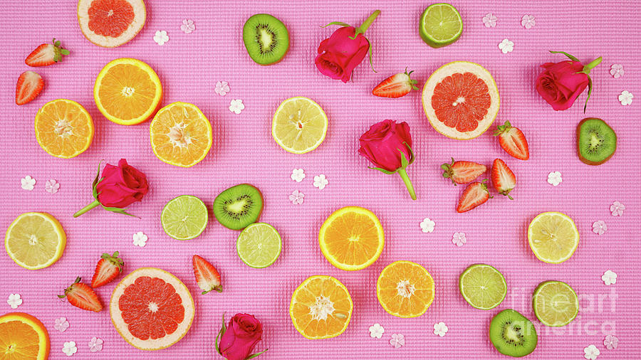 Summer theme background with fruit, citrus and flowers on pink backdrop. #2 Photograph by Milleflore Images