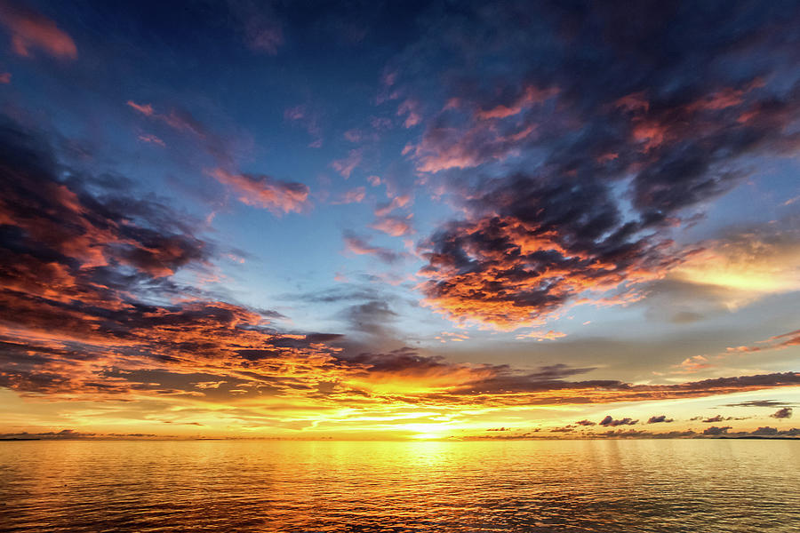 Sun Setting Over The Equator In The Raja Ampat Islands Of West Papua In ...