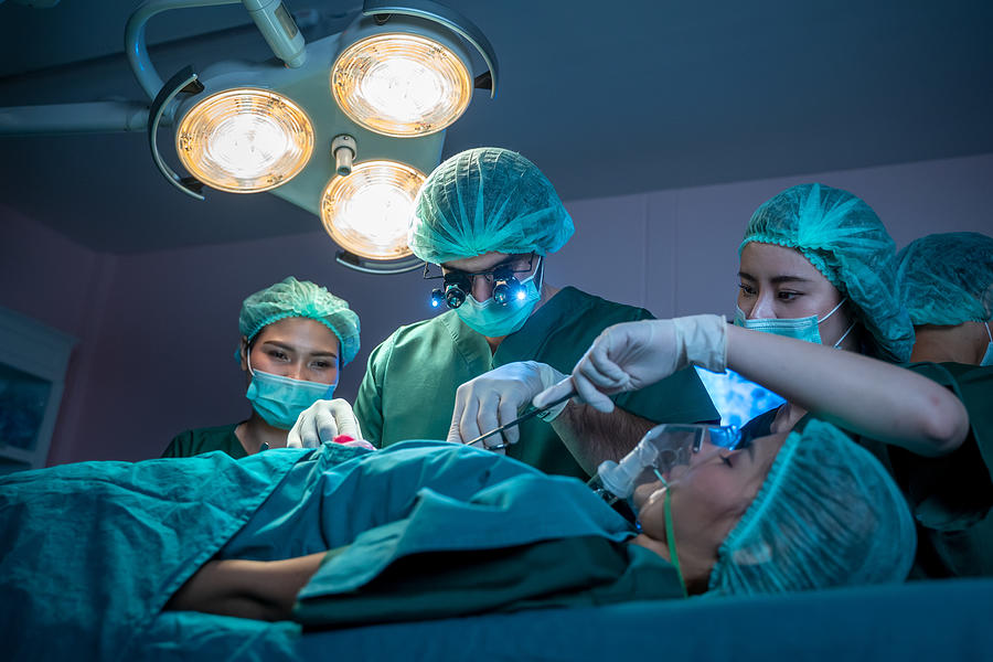 Team Of Professional Surgeons And Nurses Suture Wound Photograph by ...