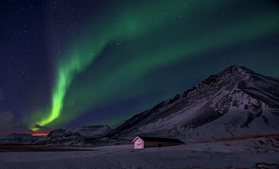 The Northern Lights Illuminate The Icelandic Winter Sky Photograph by ...