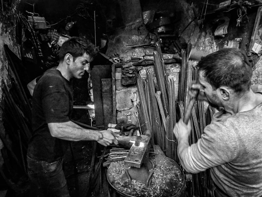 Man Photograph - The Traditional Blacksmithing Profession In The City Of Mosul #2 by Bashar Alsofey