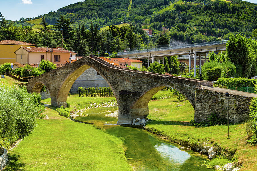 three archs medieval bridge in Italy Photograph by Vivida Photo PC