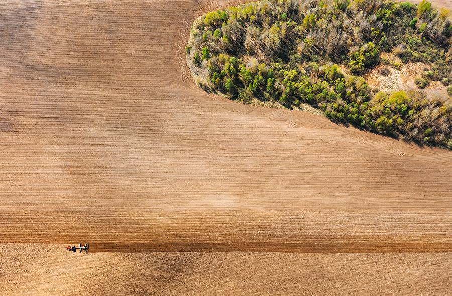 Spring Photograph - Tractor Plowing Field In Spring #2 by Ryhor Bruyeu