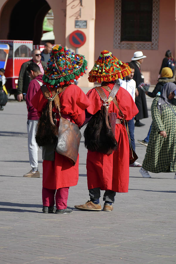 Traditional water seller in red uniform #2 Photograph by Steve Estvanik