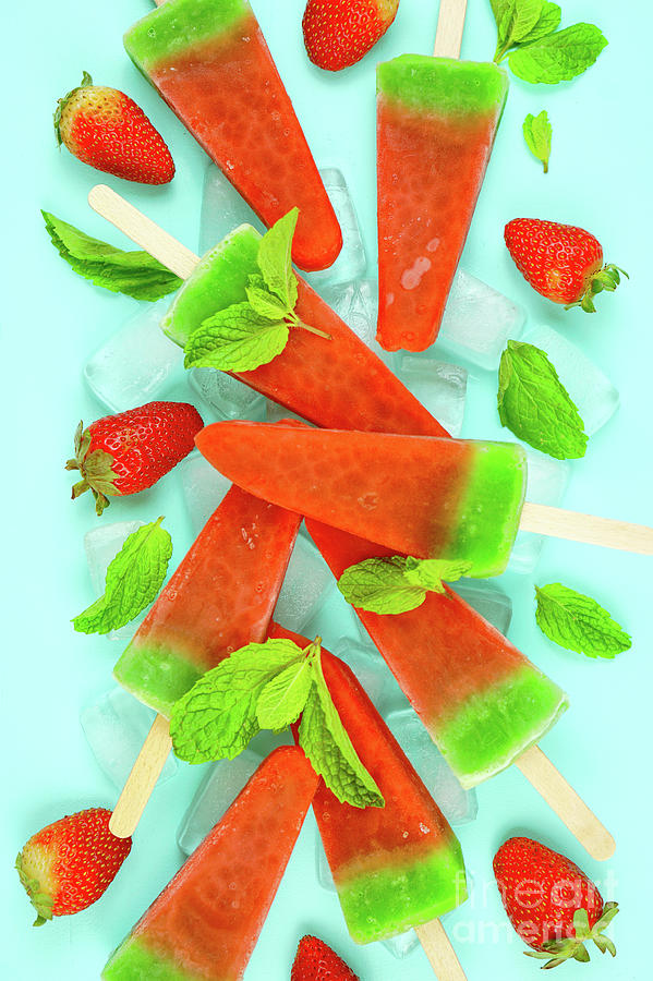 Watermelon flavored summer ice cream popsicles on pink and blue background. #2 Photograph by Milleflore Images