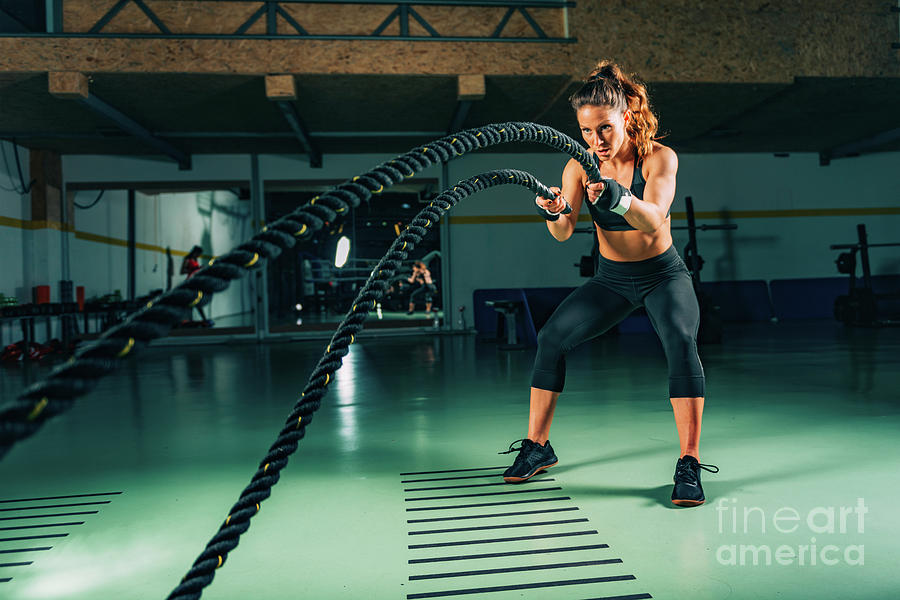 Woman Exercising With Battle Ropes #2 Photograph by Microgen Images/science Photo Library
