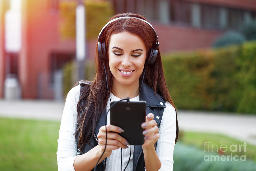 Woman Listening To Music On Headphones #2 Photograph by Sakkmesterke/science Photo Library