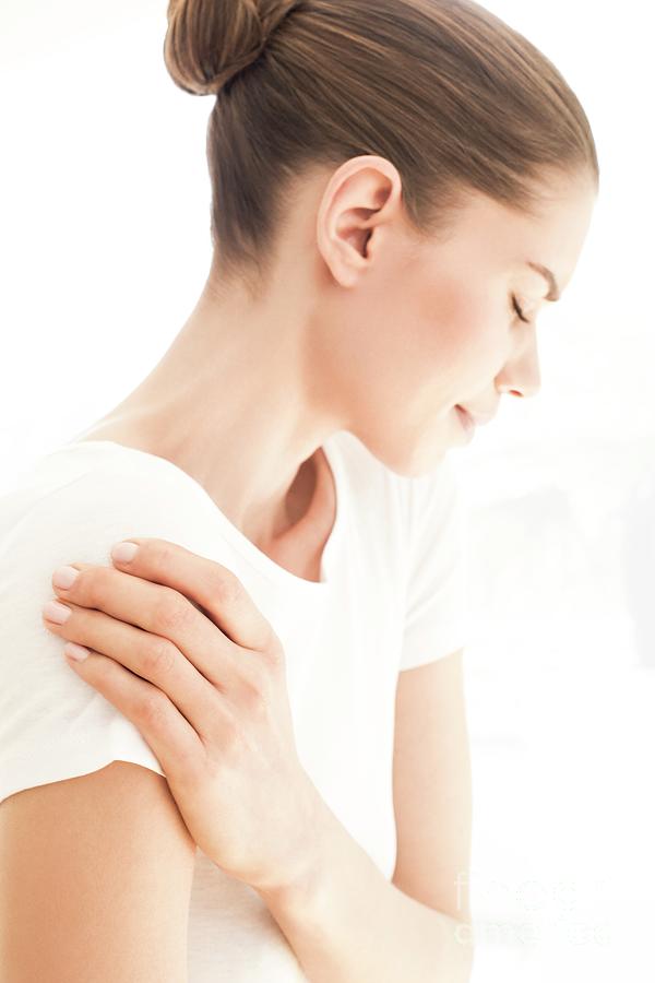 Woman Rubbing Her Shoulder Photograph by Ian Hooton/science Photo