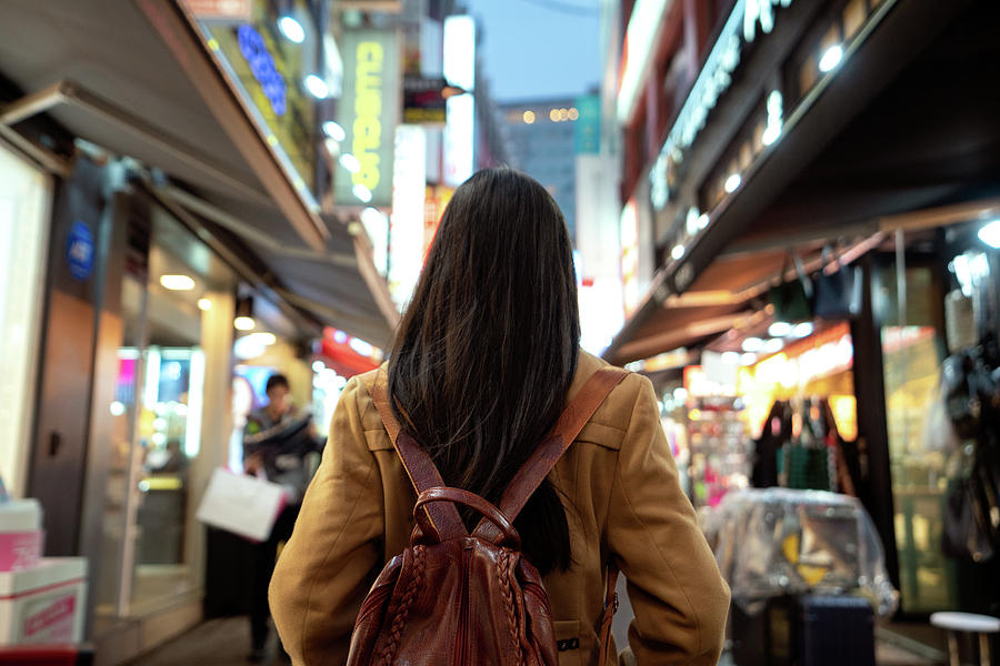 Architecture Photograph - Young asian woman traveler traveling and shopping in Myeongdong  #2 by Anek Suwannaphoom