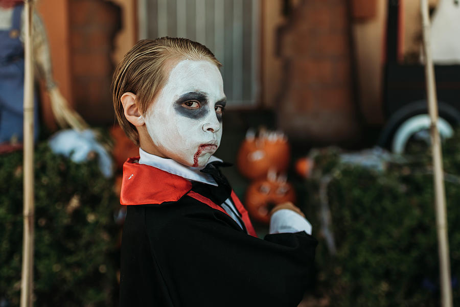 Halloween Photograph - Young Boy Dressed As Dracula Posing In Costume At Halloween #2 by Cavan Images