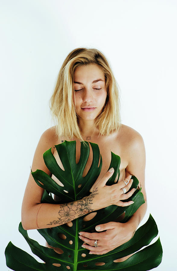 Young Naked Woman Covering Her Body Palm Leaf On White Background Photograph By Cavan Images 4933