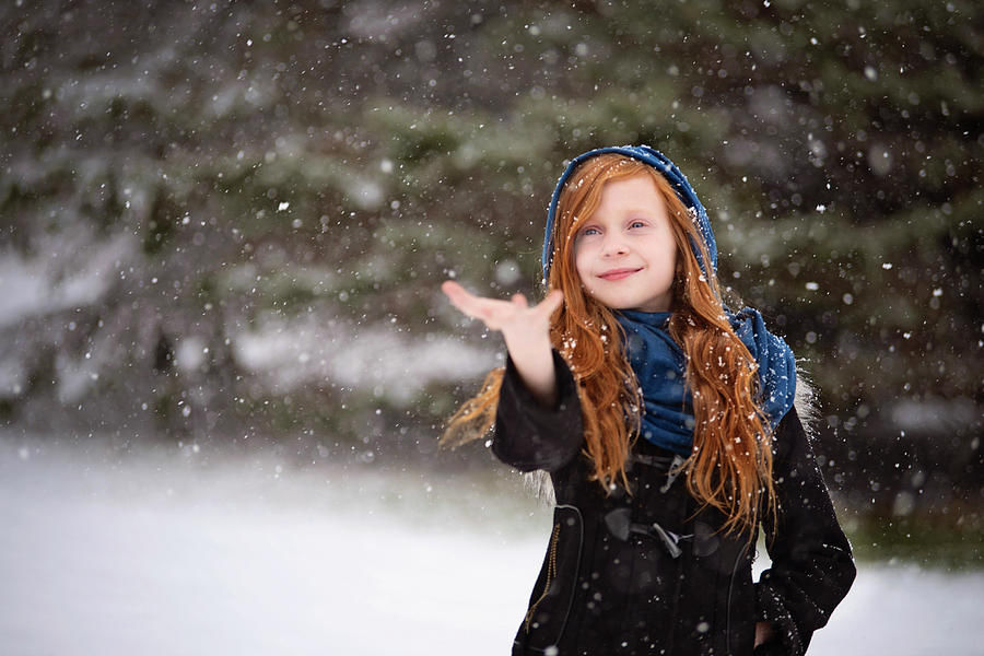 Young Red Haired Girl Playing Outside In The Snow Photograph By Cavan 