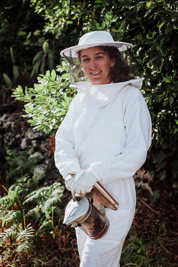 Nature Photograph - Young Woman Beekeeper At Work In A Nature #2 by Cavan Images