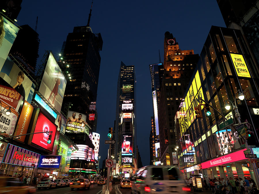 Buildings In A City Lit Up At Dusk Photograph by Panoramic Images ...